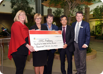 LHSC Auxiliary President Louise McKnight (left) presents a cheque for $2.24 million, to LHSC Chief Clinical Officer Laurie Gould, LHSF Chair Tod Warner, LHSC Chair Chief Clinical Pharmacology Dr. Richard Kim and LHSF President & CEO John MacFarlane. Hospital volunteers support Personalized Medicine Program