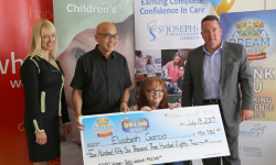 50/50 Plus lottery winner Elizabeth Garcia (seated) and her husband Antonio (second from left) receive their big cheque from LHSF Chief Operating Officer Evelyn Salhani (left) and CHF President & CEO Scott Fortnum (right). 50/50 Plus lottery winner Elizabeth Garcia (seated) and her husband Antonio (second from left) receive their big cheque from LHSF Chief Operating Officer Evelyn Salhani (left) and CHF President & CEO Scott Fortnum (right).